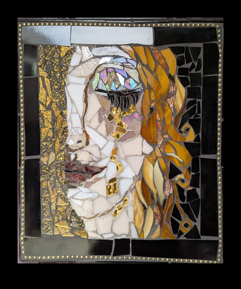 Glass Tears – Stained Glass Mosaic by Alicia Taylor Low | Rooted in Radiance Collection Glass Tears – Stained Glass Mosaic by Alicia Taylor Low<br />
A soulful stained glass mosaic in moody blues and purples with flowing shapes and glistening accents. Created with stained glass, gemstones, and found materials, this piece evokes sorrow, beauty, and release. Part of the Rooted in Radiance Solstice collection.