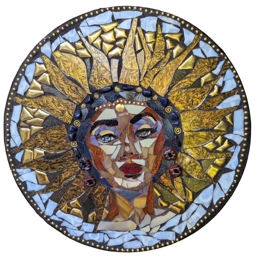 she-who-shines-stained-glass-mosaic-alicia-taylor-low-alicia-taylor-low She Who Shines – Stained Glass Mosaic by Alicia Taylor Low<br />
A luminous stained glass mosaic featuring a radiant female figure in warm golden hues, surrounded by circular motion and tiny sparkling details. Made with stained glass, beads, and soulful findings, this piece honors feminine power, visibility, and sacred self-expression. Part of the Rooted in Radiance Solstice collection.